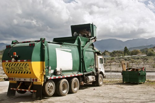 Crew loading mixed commercial rubbish into a vehicle